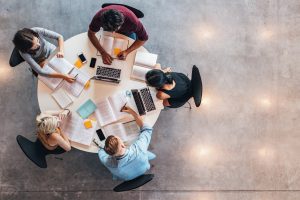 Five students engage in a group study session