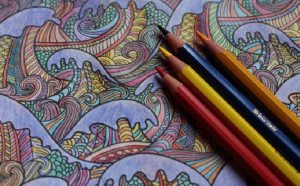 adult coloring book with colored pencils