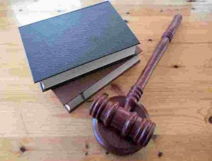 books with gavel on desk