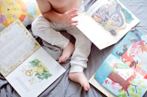 Baby playing with books
