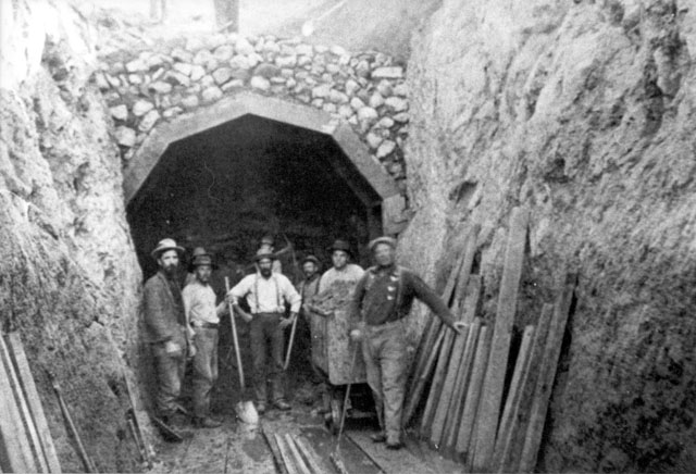 Workers standing in front of tunnel entrance in the Los Angeles-Owens Valley Aqueduct