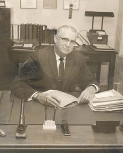 Leland R. Weaver at his desk