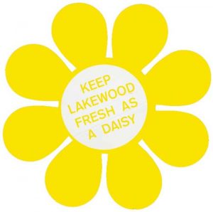 Yellow decal in a daisy shape that asks Lakewood residents to 'Keep Lakewood Fresh as a Dairy"
