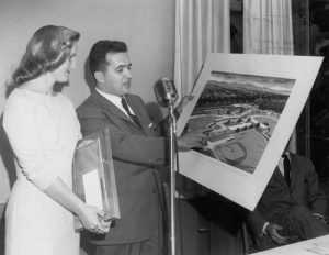 Angelo M. Iacoboni holding the plan for the new civic center