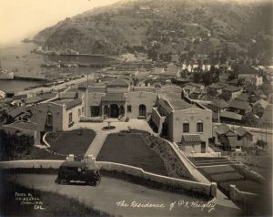 Front garden and façade of Philip K. Wrigley home overlooking Avalon Bay with the bay in the background, 1930s