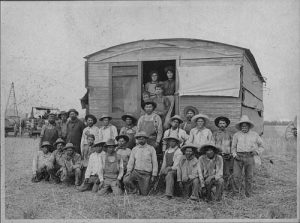 Farm workers and a threshing machine in the San Fernando Valley
