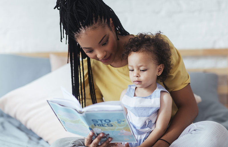 woman reading with child