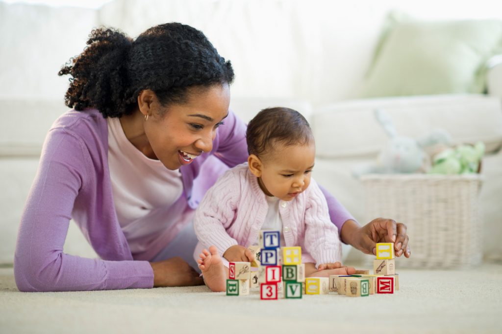 mother and baby playing with blocks
