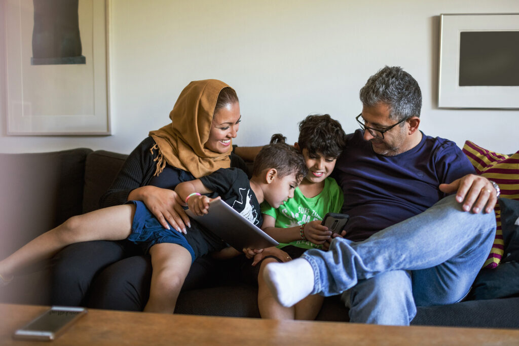 Muslim family reading together