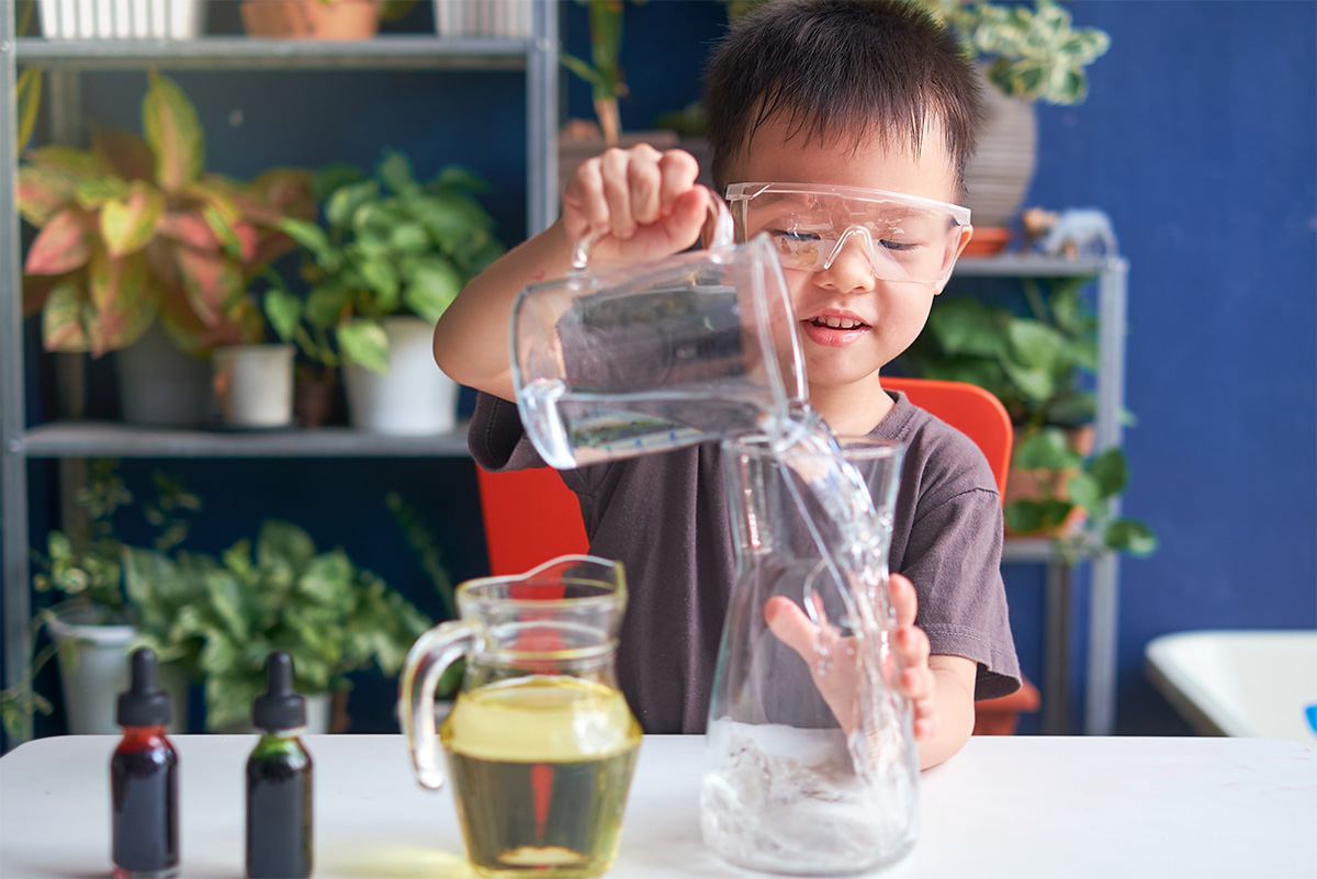 child doing science experiment