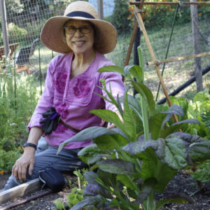 Woman growing Asian vegetables