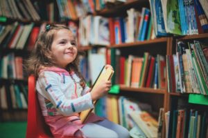 young girl in library