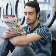 man reading a comic book