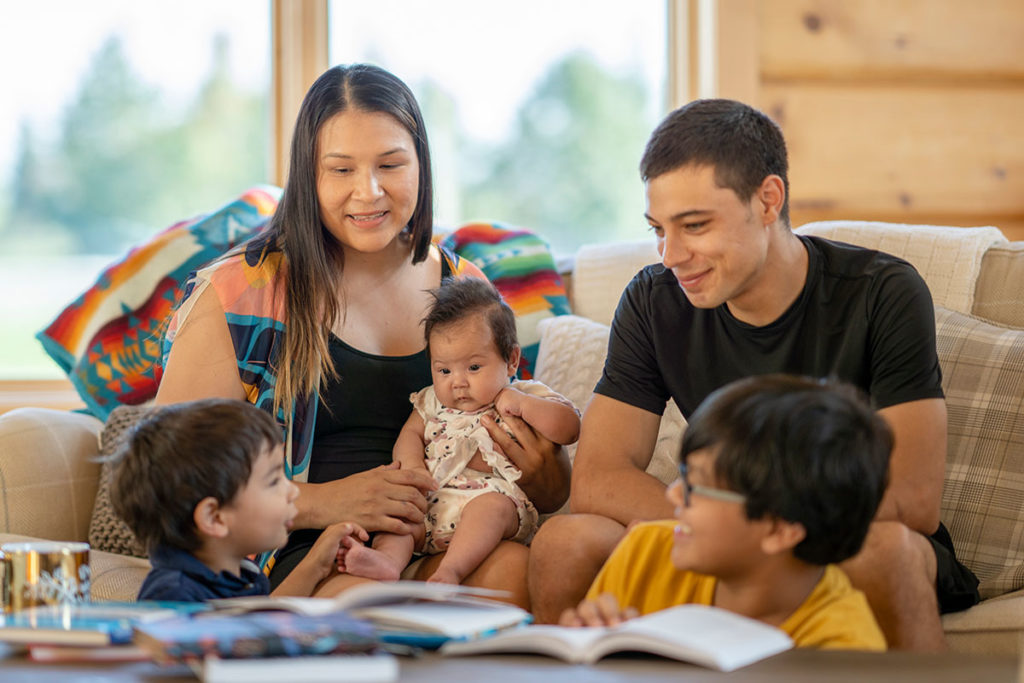 Native American family reading together