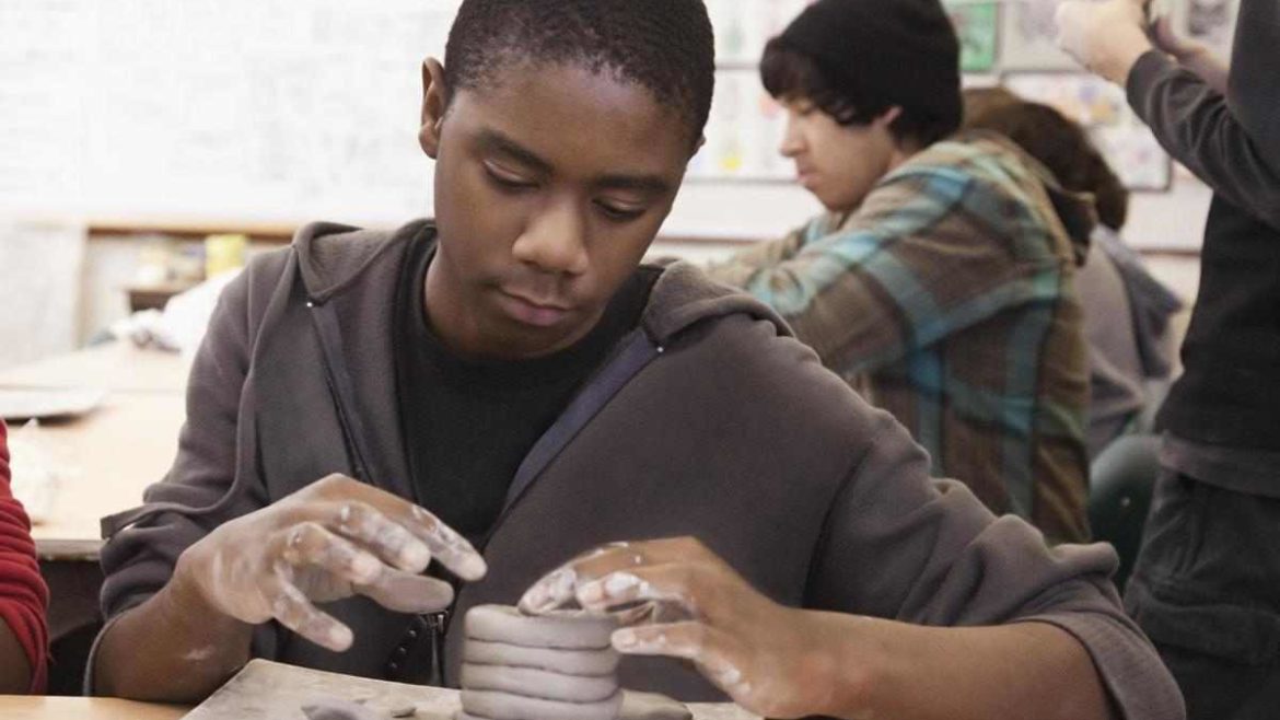boy working with clay