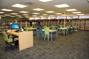 bright work area and reference desk at Claremont Library
