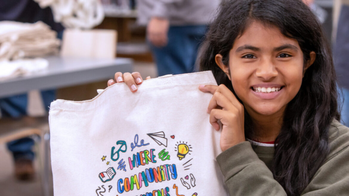 girl with Where Community Happens Tote at a LA County Library location