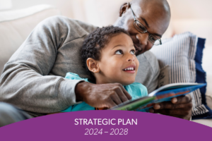 Adult and child reading a book representing the LA County Library Strategic Plan