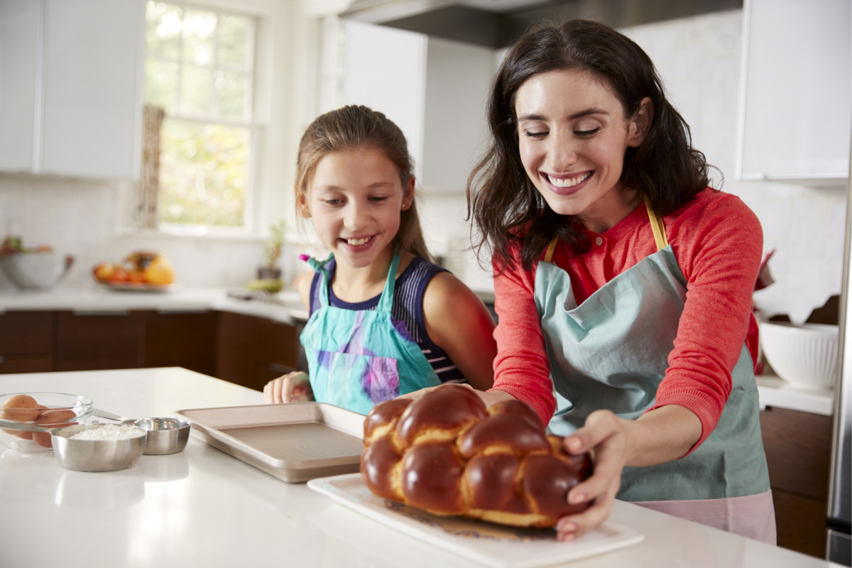 Mother and daughter making Challah bread