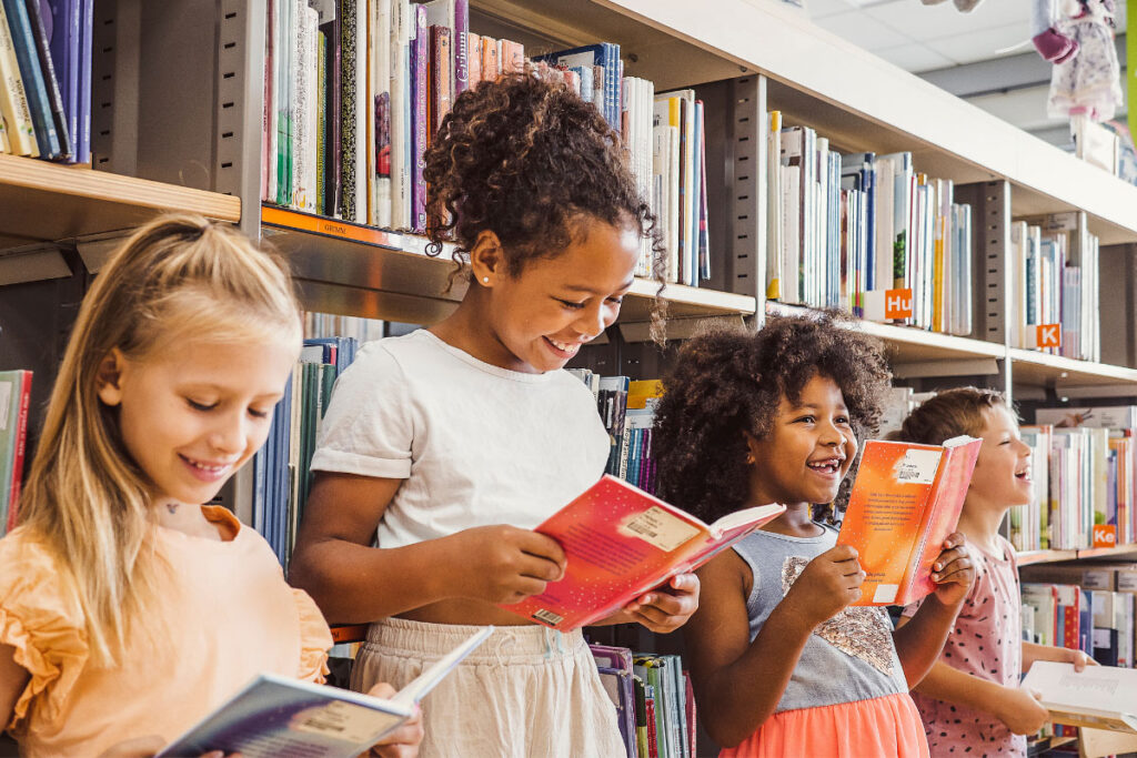 kids reading books at the library