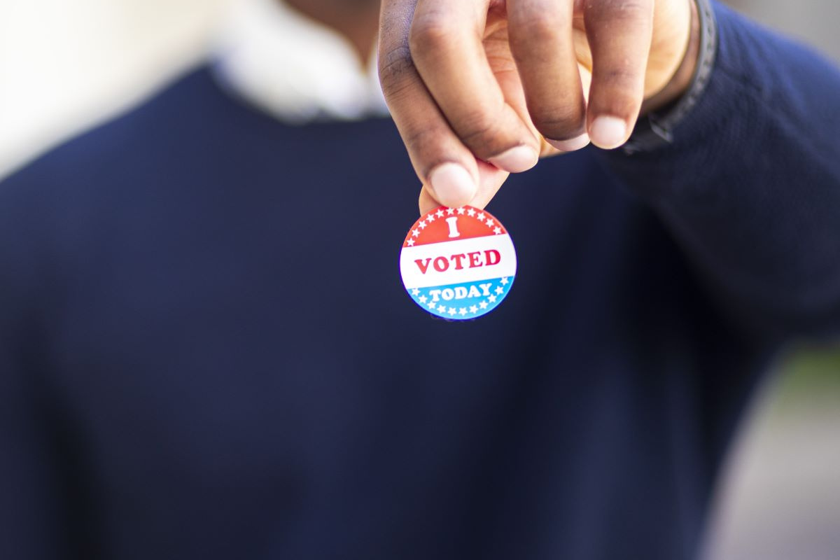 Person holding an I Voted Today sticker