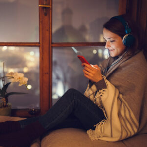 Woman listening to music on headphones