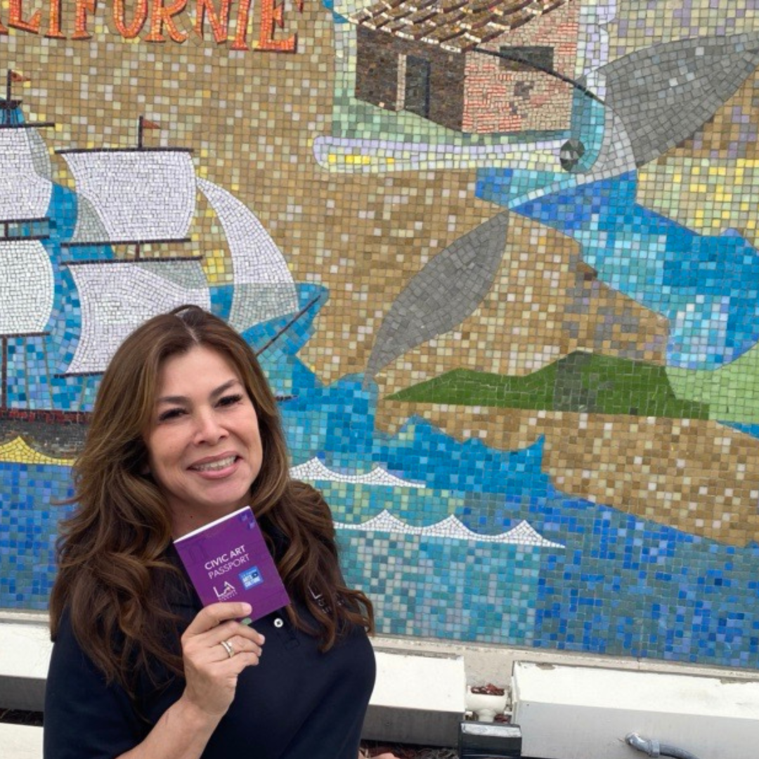 Women holding an LA County Arts Month Civic Arts Passport