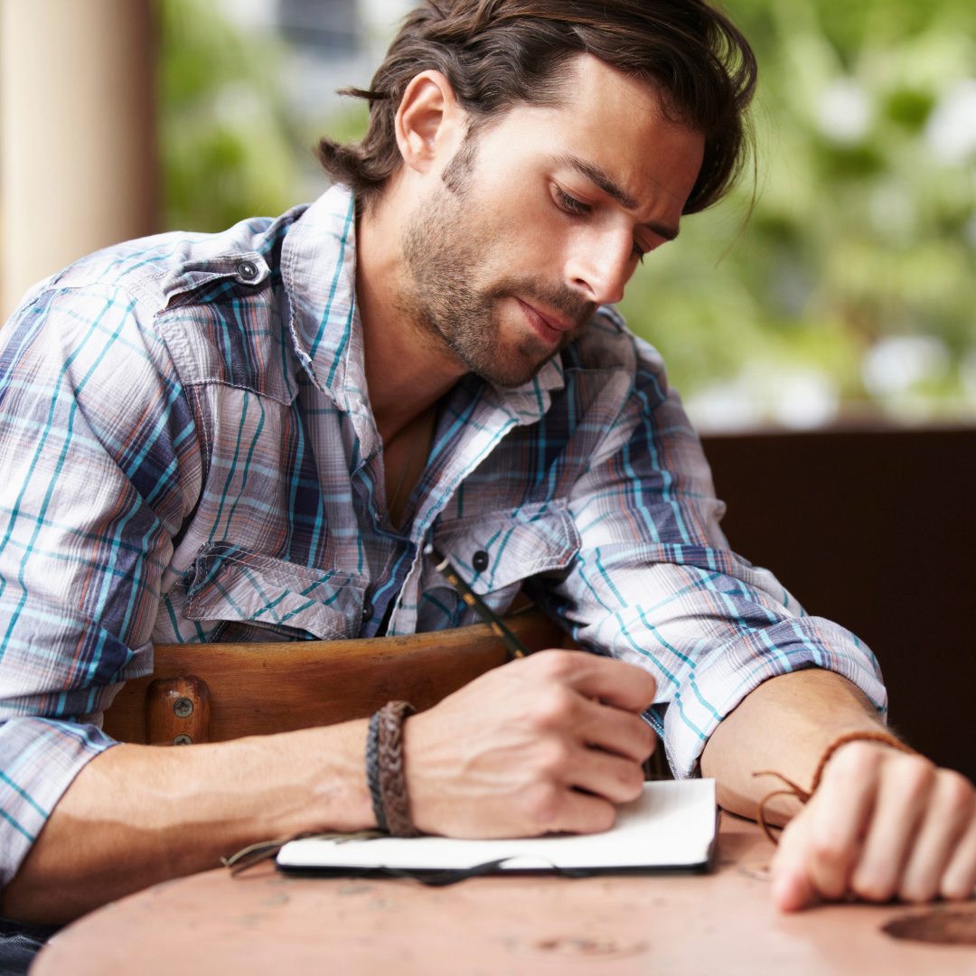 man writing poetry