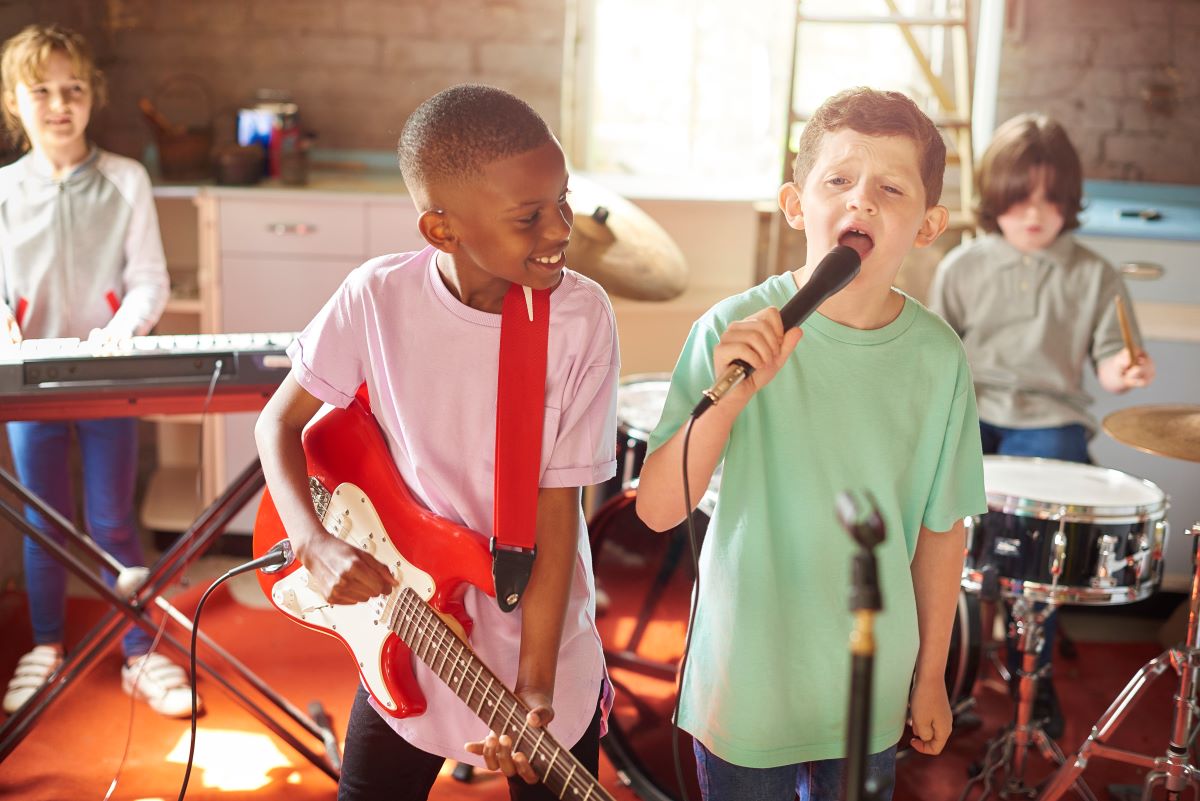 kids playing instruments in a rock band