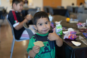 child having lunch at LA County Library during the summer lunch program