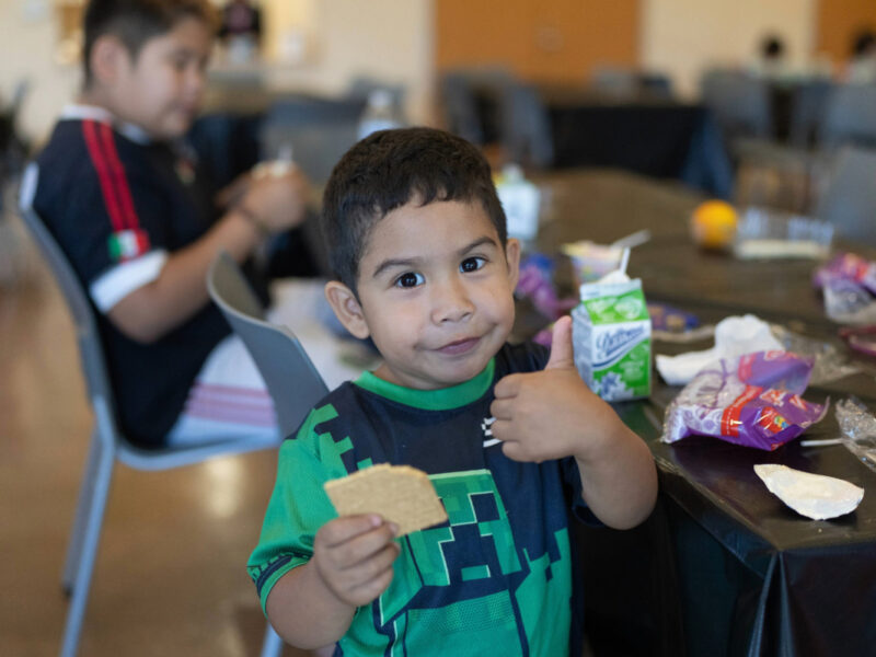 child having lunch at LA County Library during the summer lunch program
