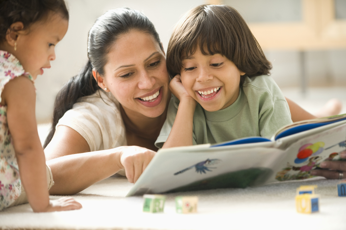 mom reading with young kids