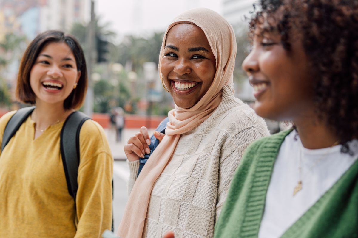 three women walking & talking