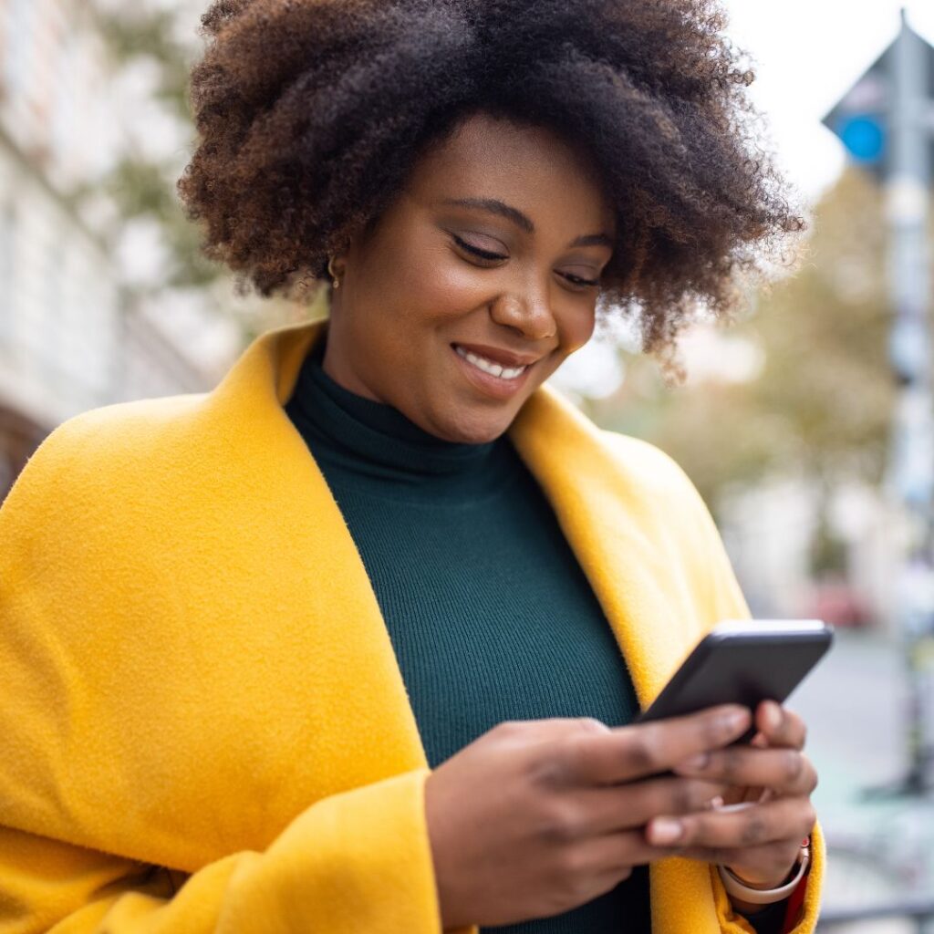 woman looking at mobile device