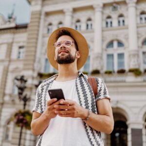 tourist using mobile device to translate