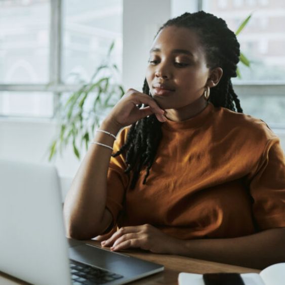 female writer using a laptop computer