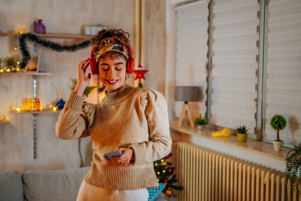 woman streaming holiday music