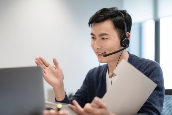 man speaking on the phone with a headset