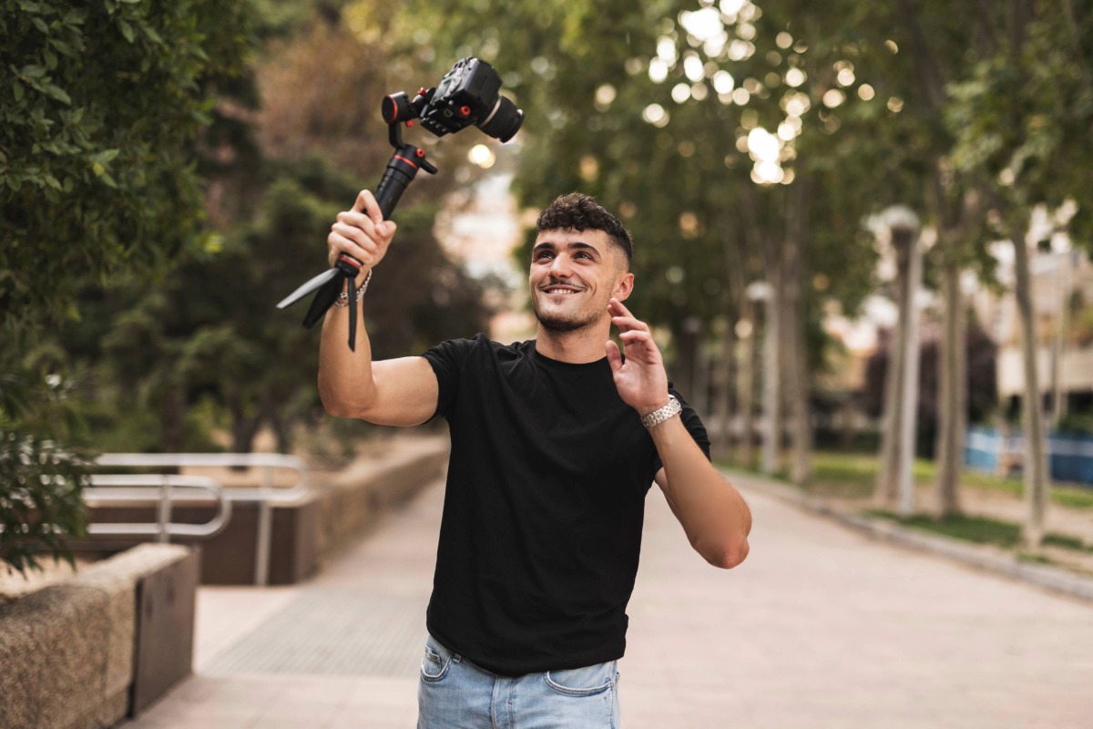 man using selfie stick to make a social media post