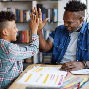 tutor and student doing a "high-five"