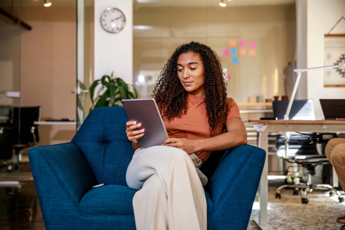 woman reading on a tablet