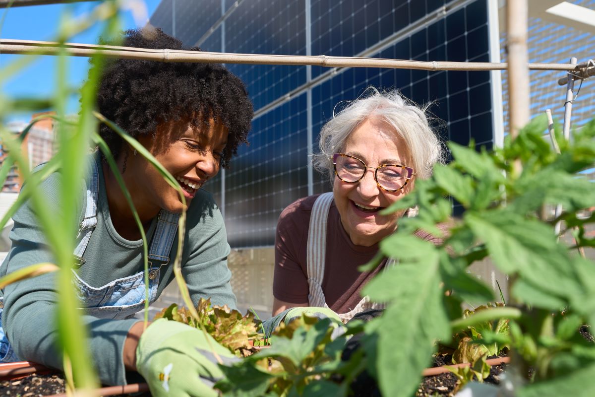 older adult and child gardening together