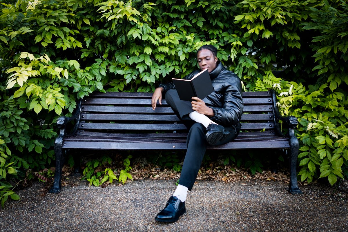 man reading in a park