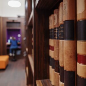 volumes of reference books in a library