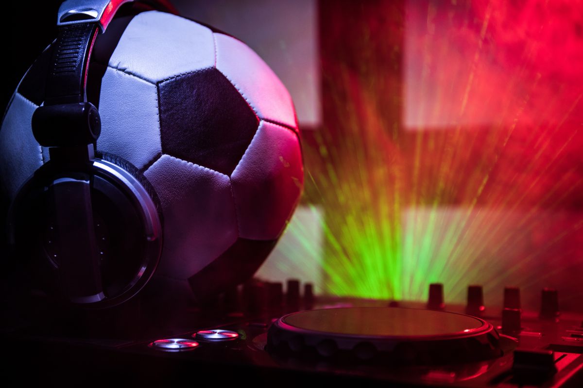 Soccer ball with headphones for a summer of soccer playlist