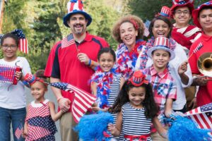 people dressed in red, white, and blue with American flags and fun hats