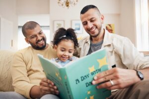 Dads reading to their daughter