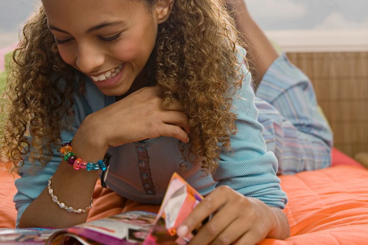Teen reading a magazine